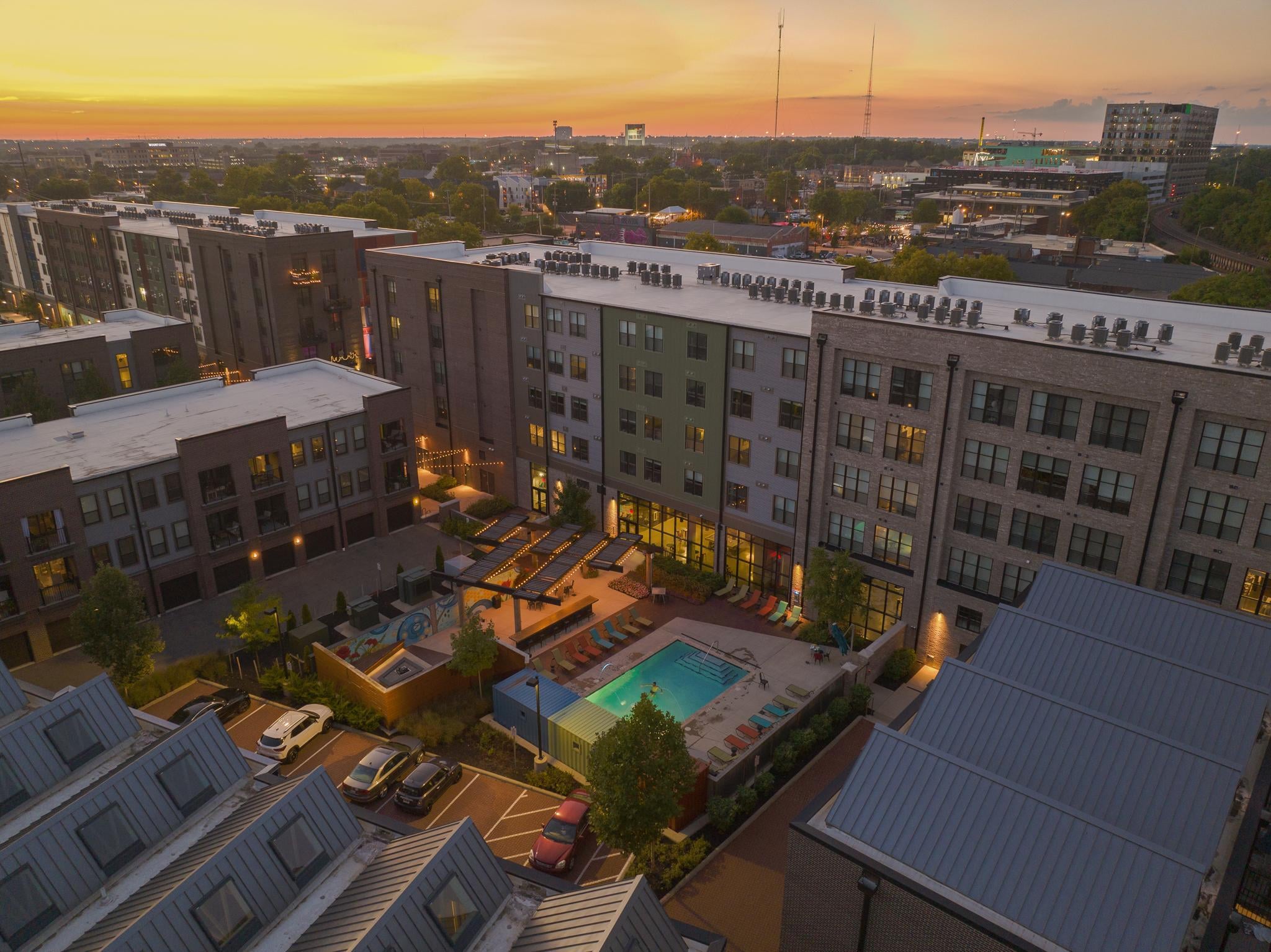 Oakwood Management apartment River & Rich, an apartment community with resort style pool, clubhouse, and surrounding multifamily building