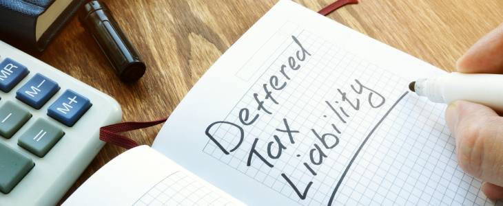 Tax Liability written in a note book 