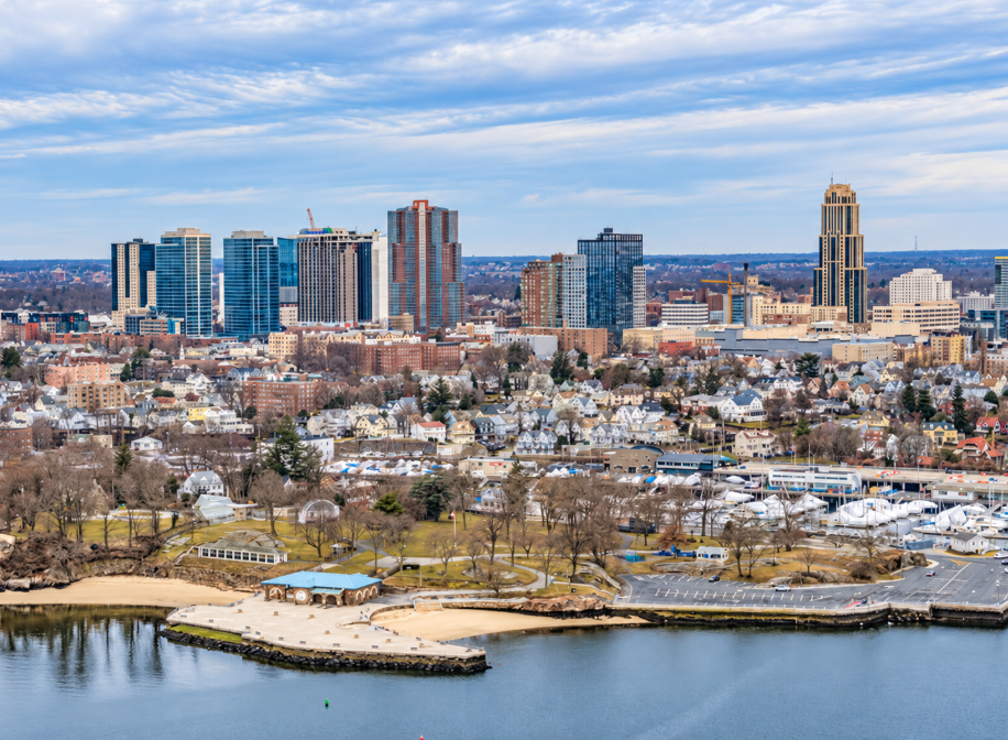 Aerial view of New Rochelle NY skyline with waterfront park and marina