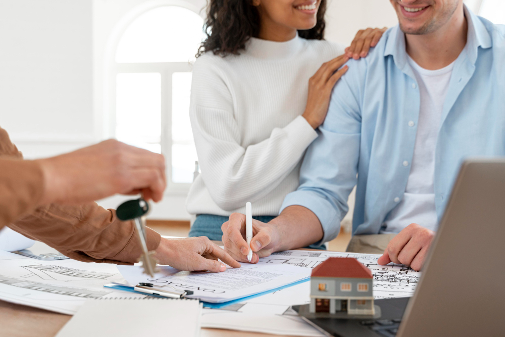 Real estate agent and client reviewing documents in front of a California home