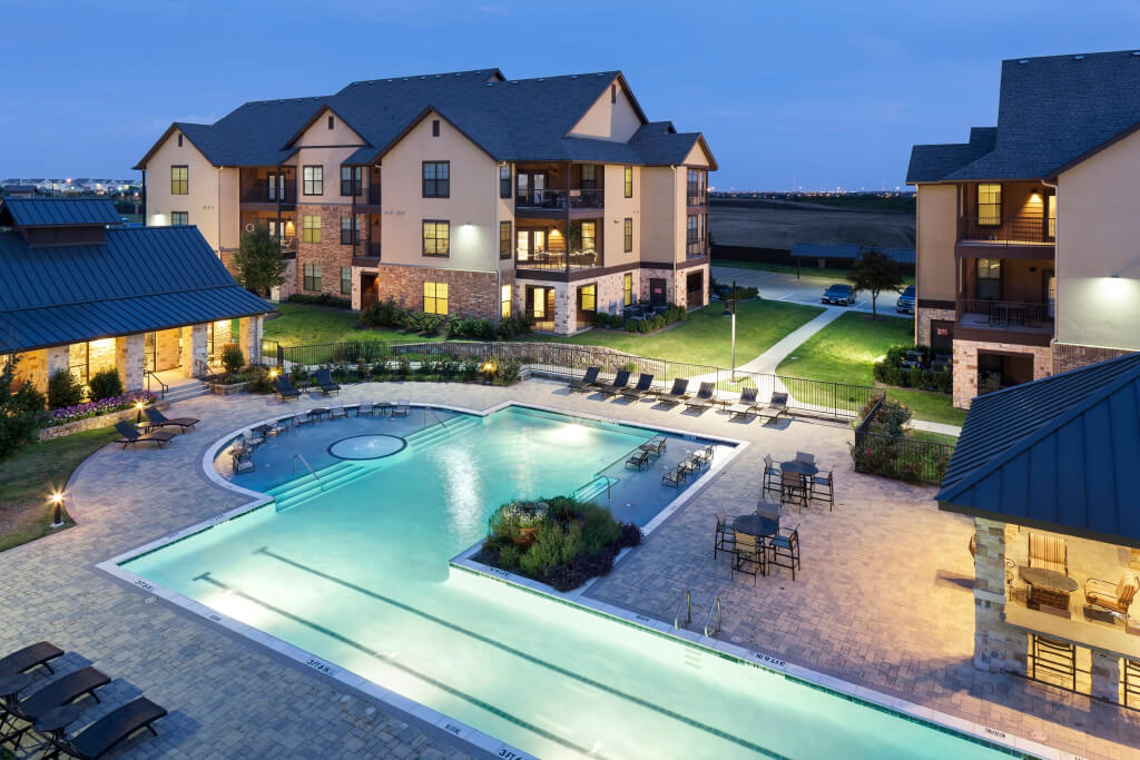 An ariel picture of the Montarra Village Apartments buildings and outdoor pool in Fort Worth, TX.