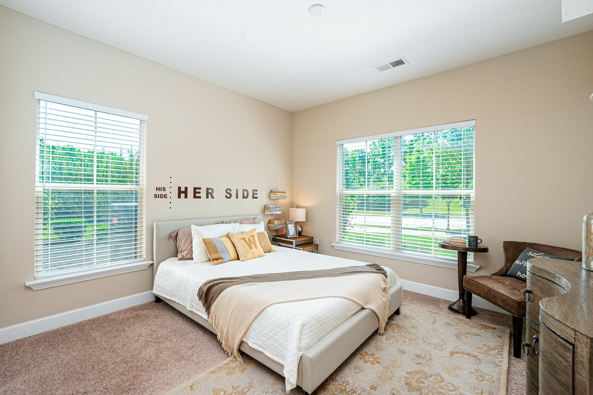 Spacious bedroom at Ravines at Westar apartments in Westerville, Ohio, featuring large windows, modern finishes, and abundant natural light.