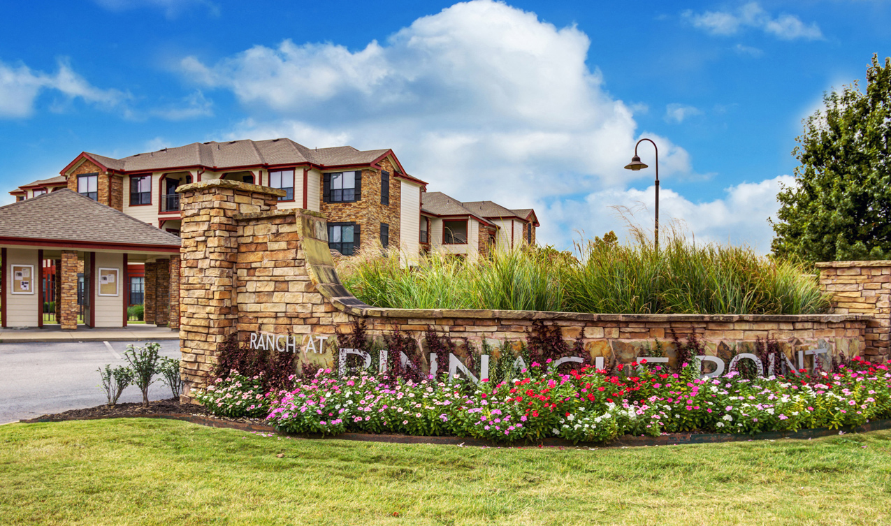 The exterior entrance to The Ranch at Pinnacle Point Apartments in Rogers, AR.