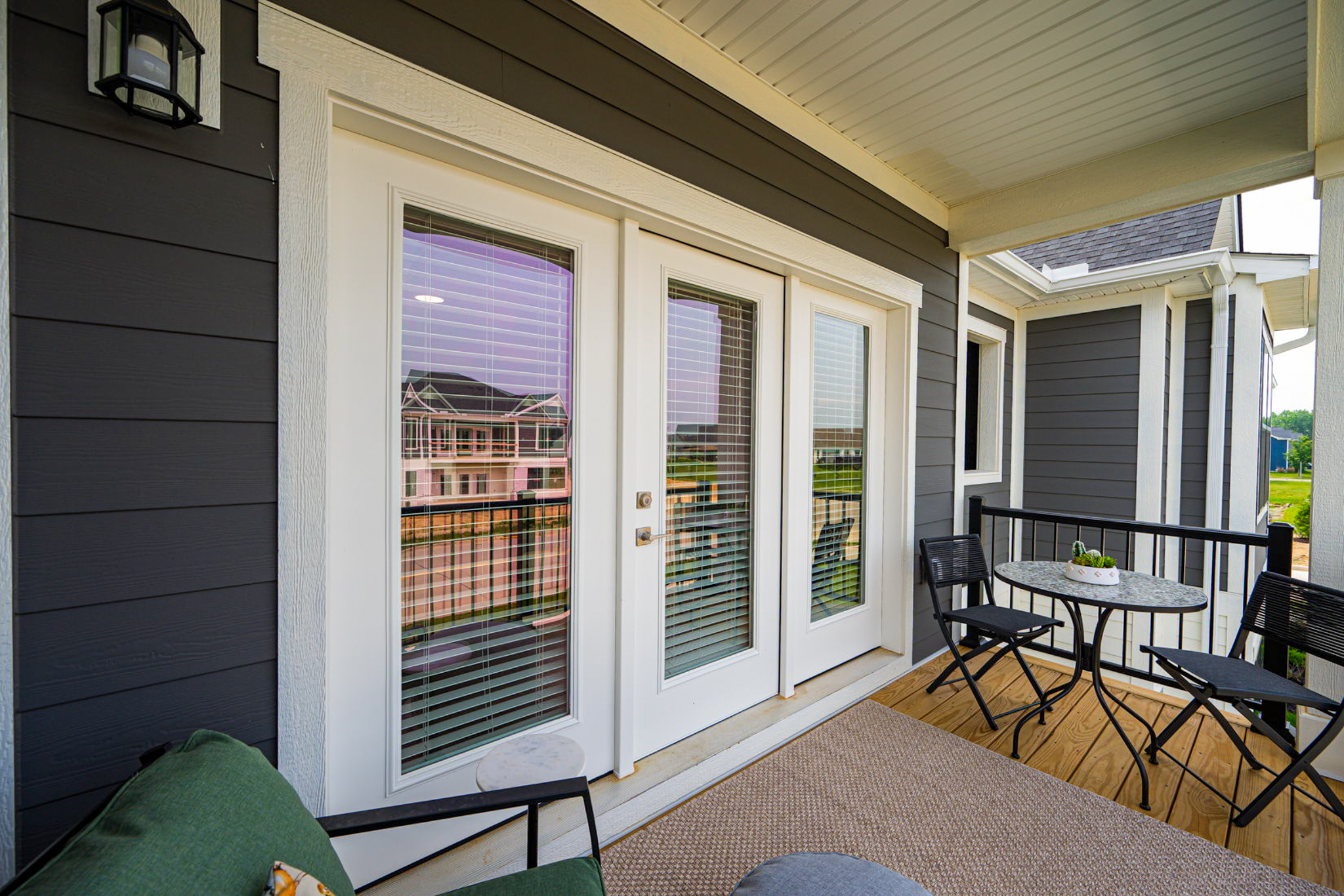 Private balcony at The Meadows at Sunbury apartments with seating and modern finishes in a quiet Sunbury, Ohio community.