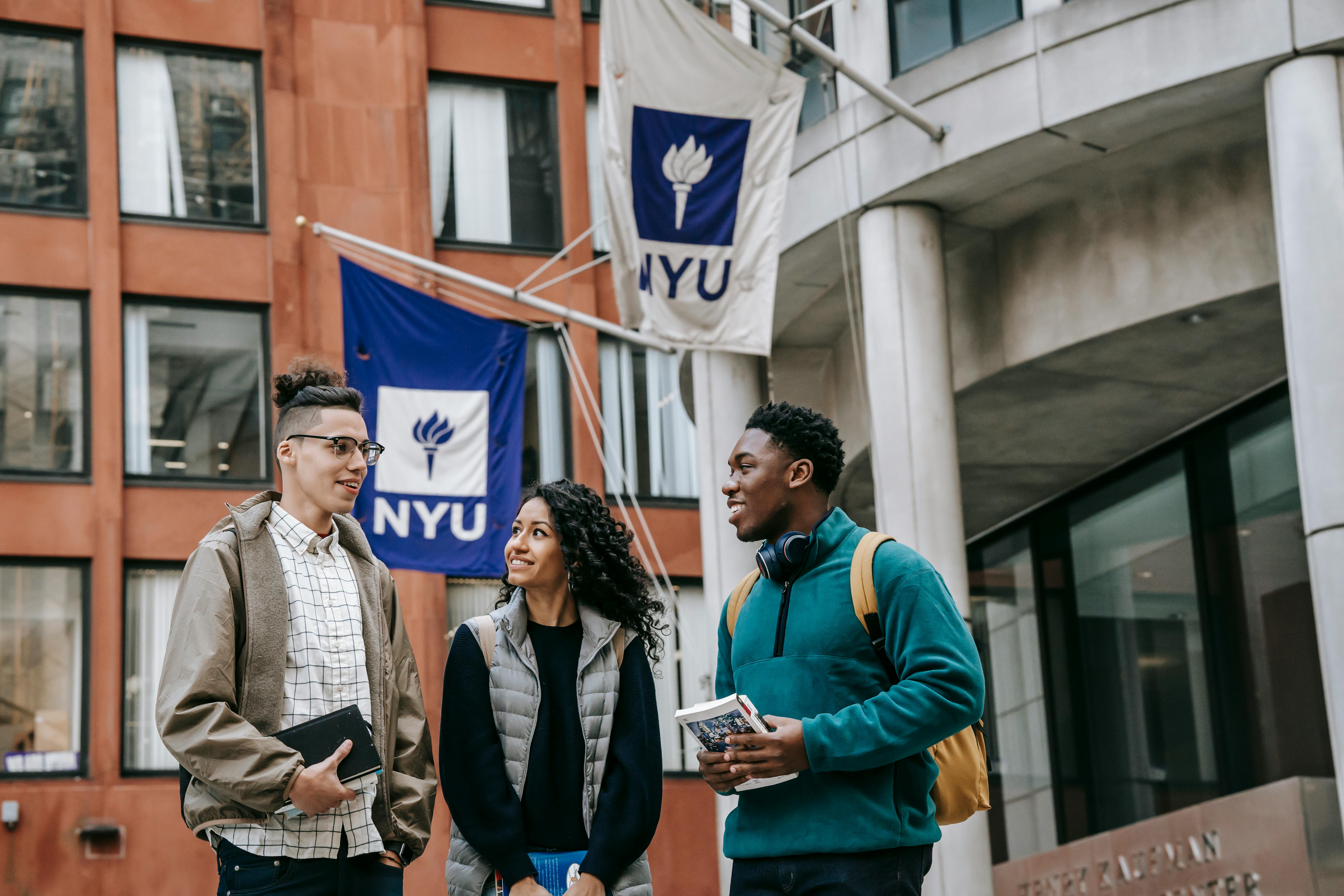 students talking in front of university
