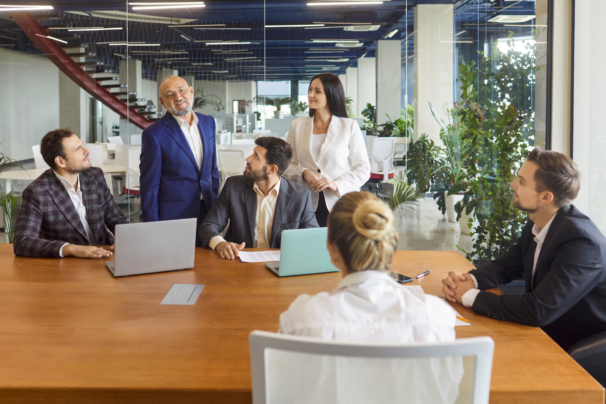 Professionals meeting in an office, representing job opportunities and employment in Dayton, Ohio.