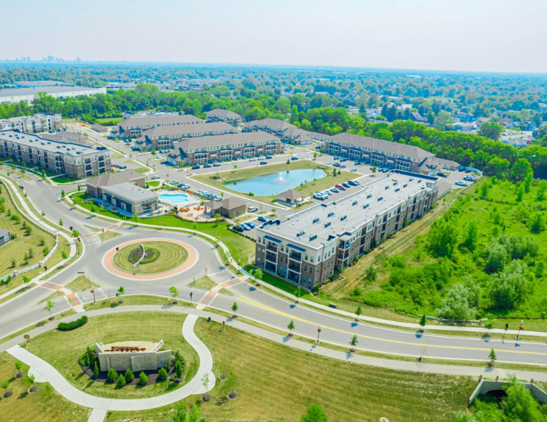 Aerial view of Beulah Place apartments in Grove City, Ohio with resort-style amenities, pond, and landscaped grounds.