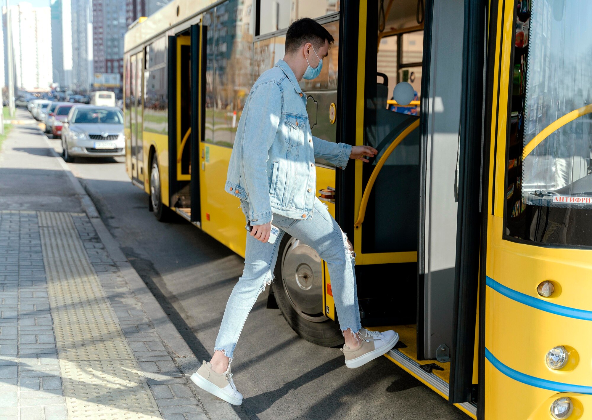 young-man-taking-city-bu