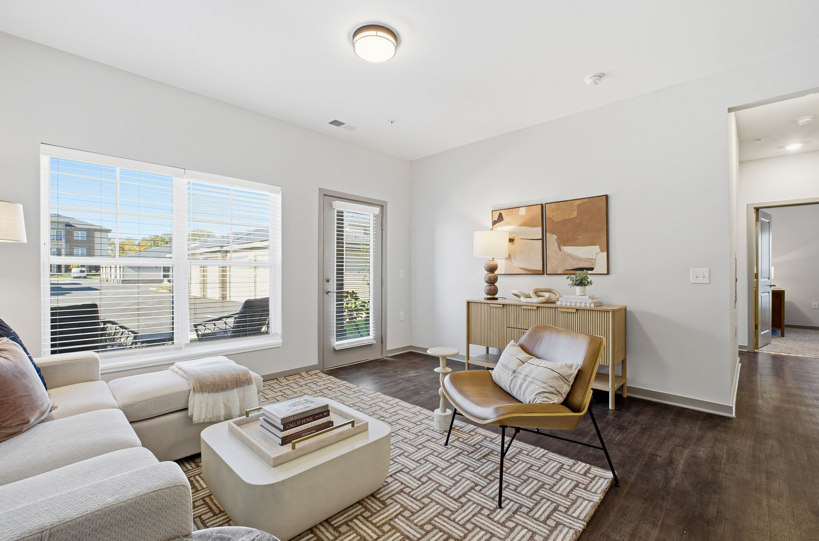 Modern living room interior at Keeneland Place apartments in Grove City, Ohio with open layout and contemporary finishes.