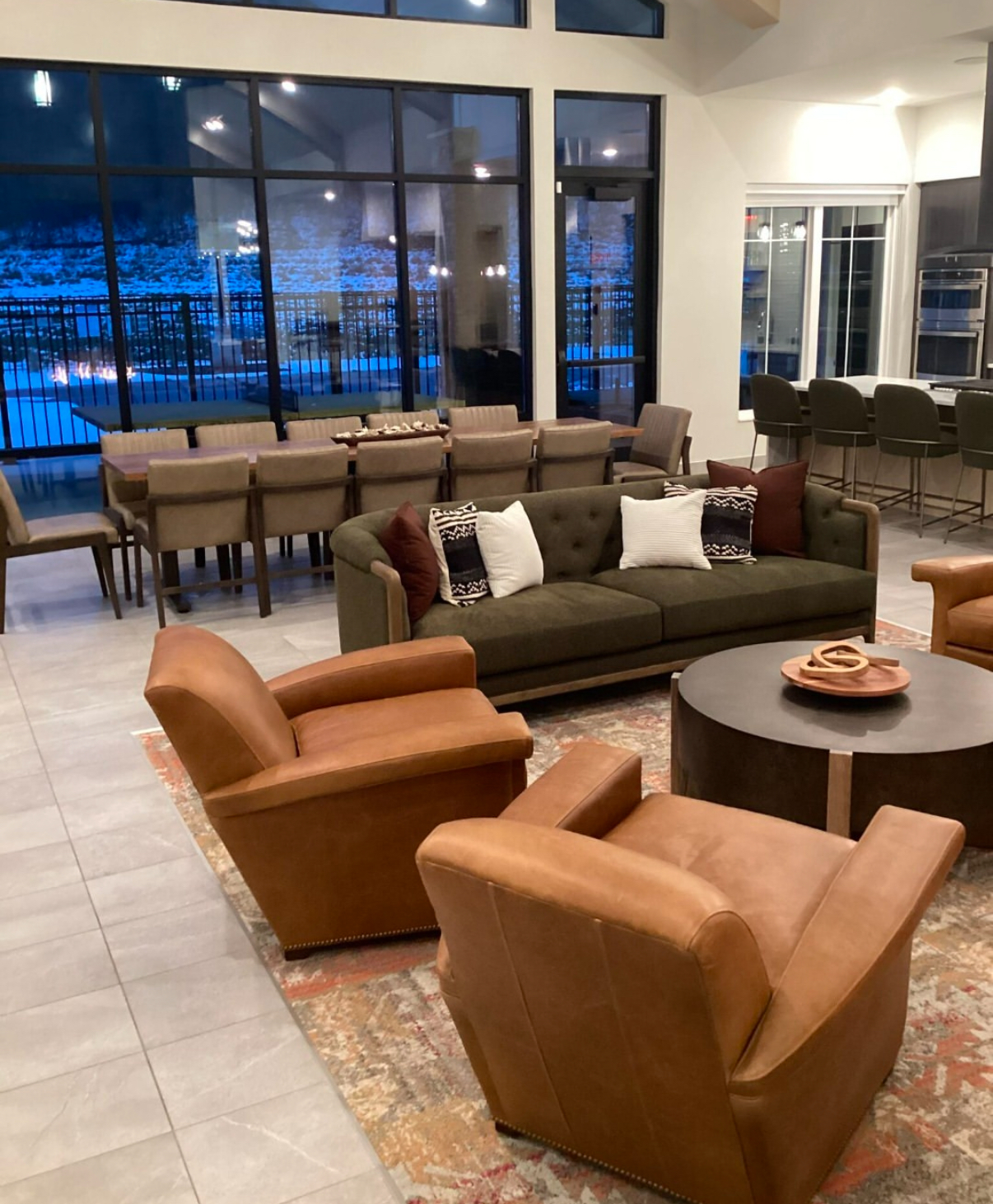The Lodge at Overland apartments in Rochester MN Weather - clubhouse interior by the fireplace with snow in the background