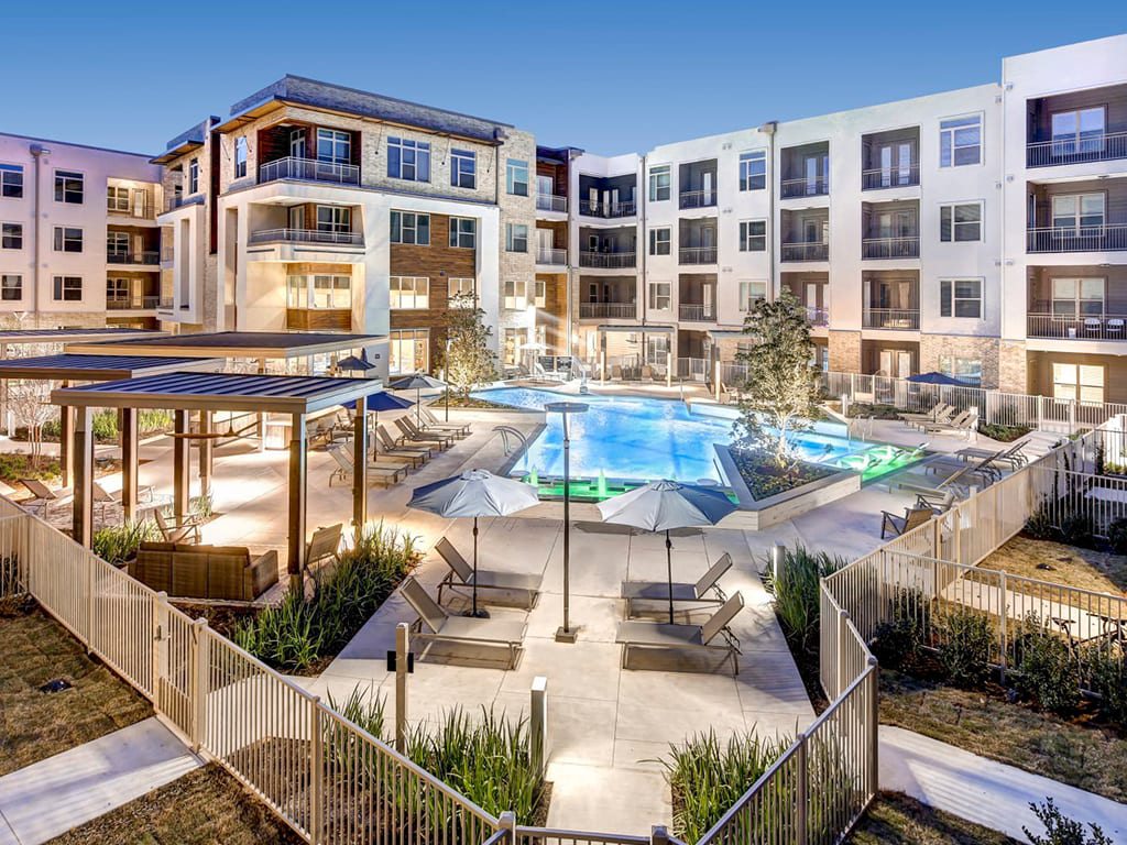 The outdoor pool at The Alden at Cedar Park Apartments in Cedar Park, TX.