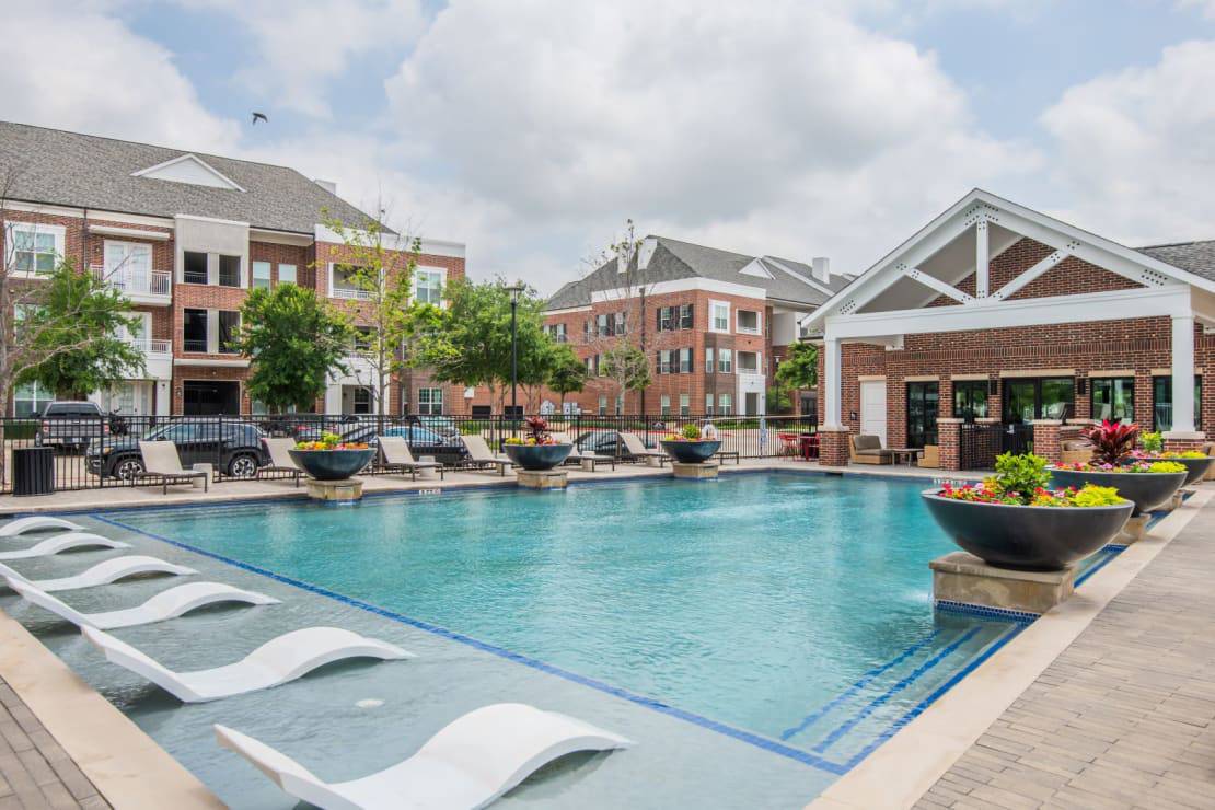 The outdoor pool at McKinney Village Apartments in McKinney, TX.
