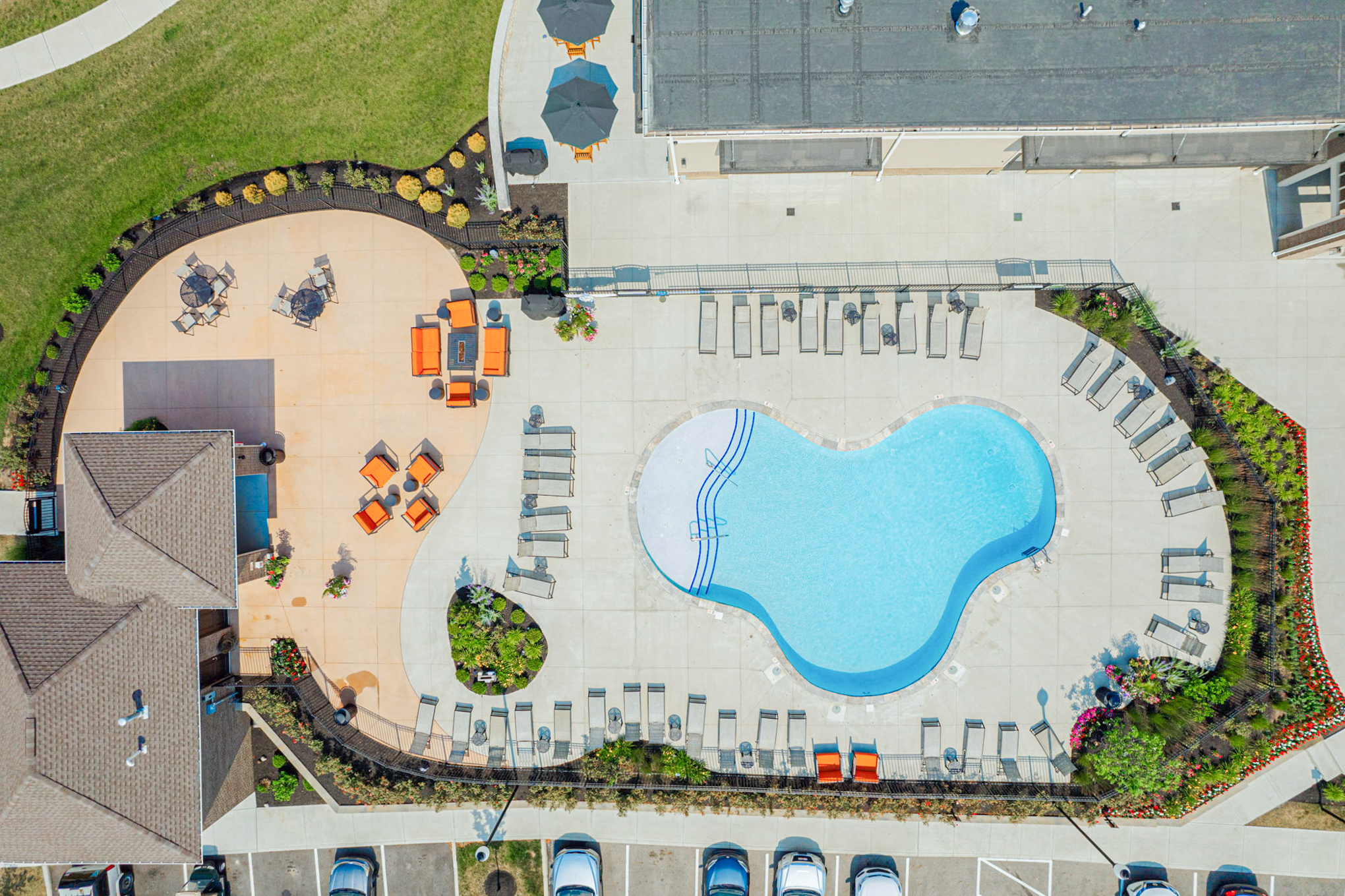 Aerial view of the resort-style swimming pool with lounge chairs and outdoor seating areas at Beulah Place Apartments in Grove City, Ohio.
