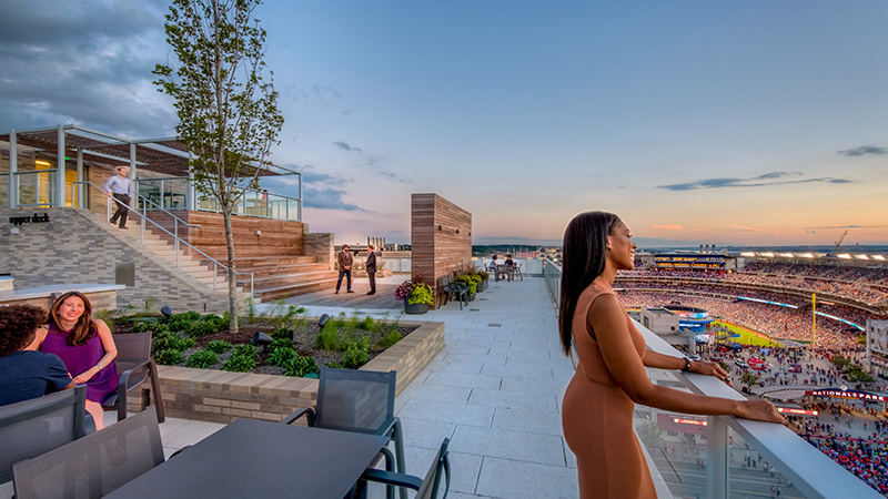 A rooftop gathering overlooking the Navy Yard ballpark in Washington, DC