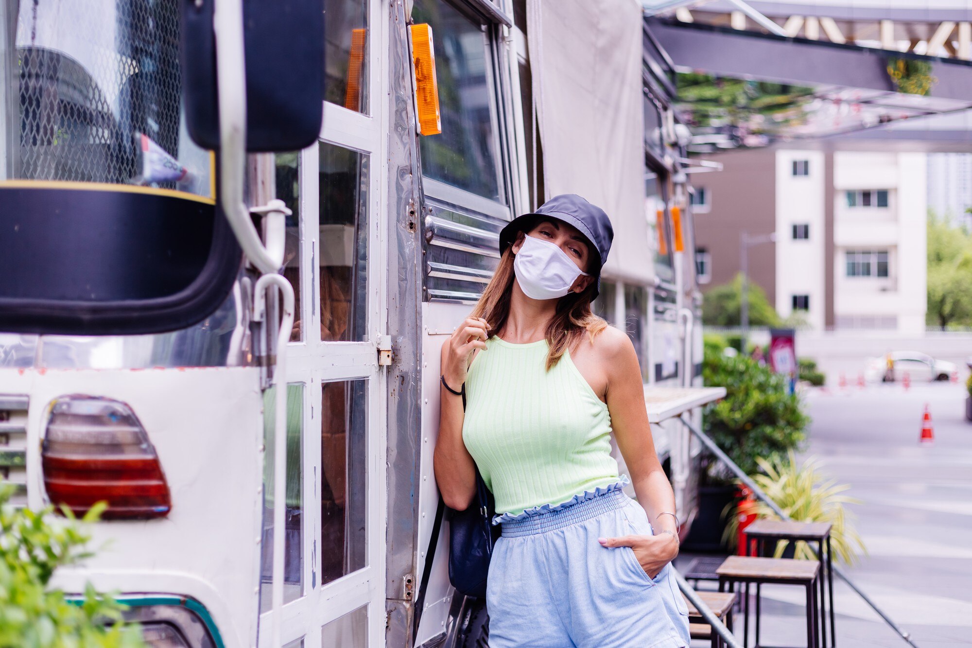Woman standing in a bus to get on in west adam