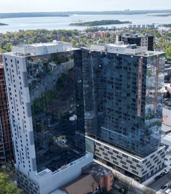 Aerial view of Encore 325 glass high-rise apartment tower in New Rochelle NY