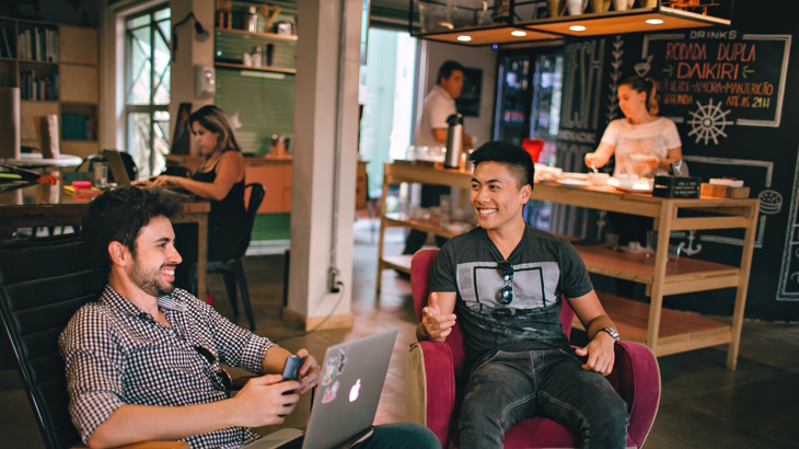 two men sitting in a cafe two men sitting in a cafe