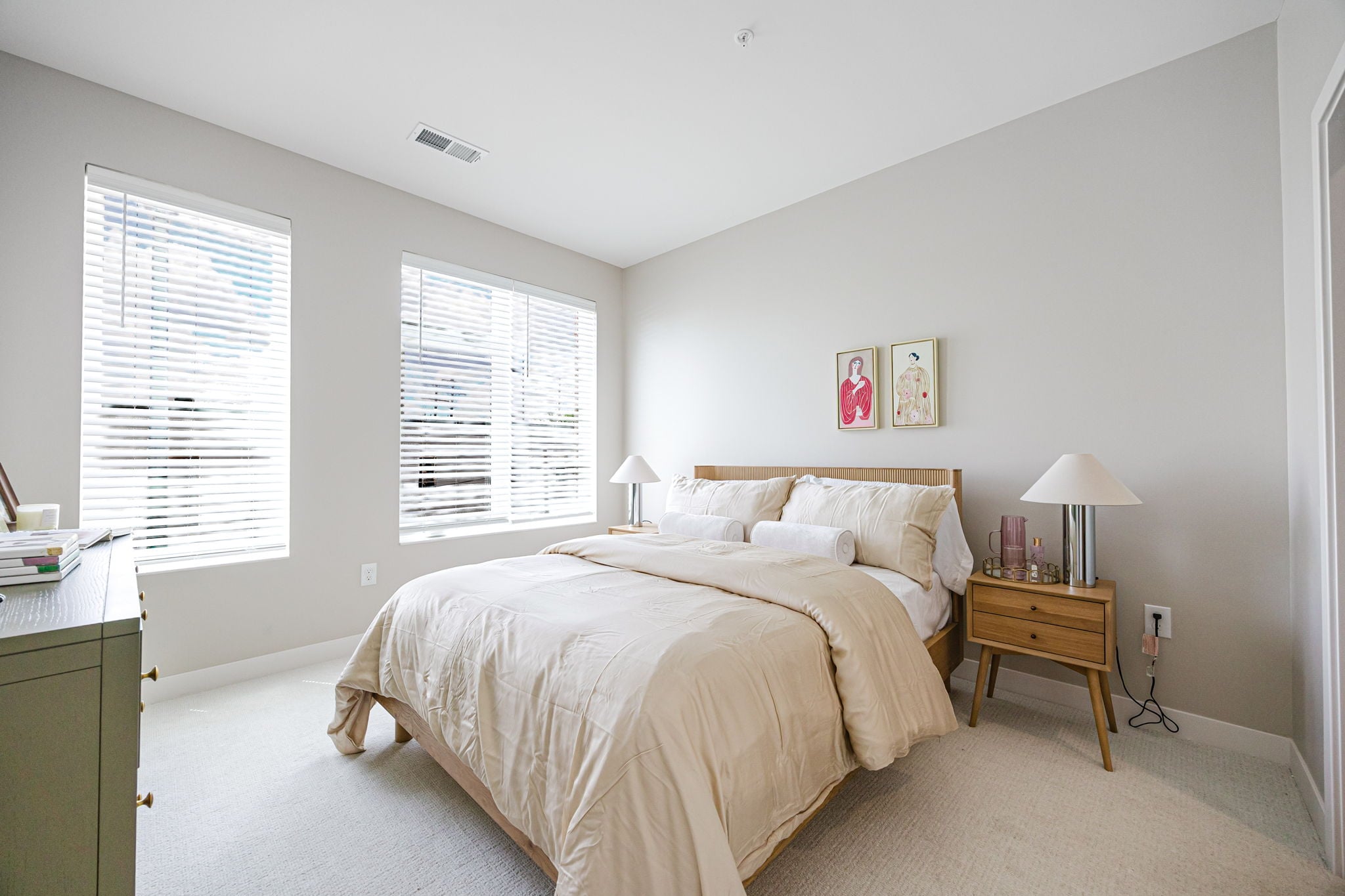 Spacious bedroom at Westrich Apartments in Columbus, Ohio, featuring plush carpeting, large windows, modern finishes, and abundant natural light in a thoughtfully designed apartment home.