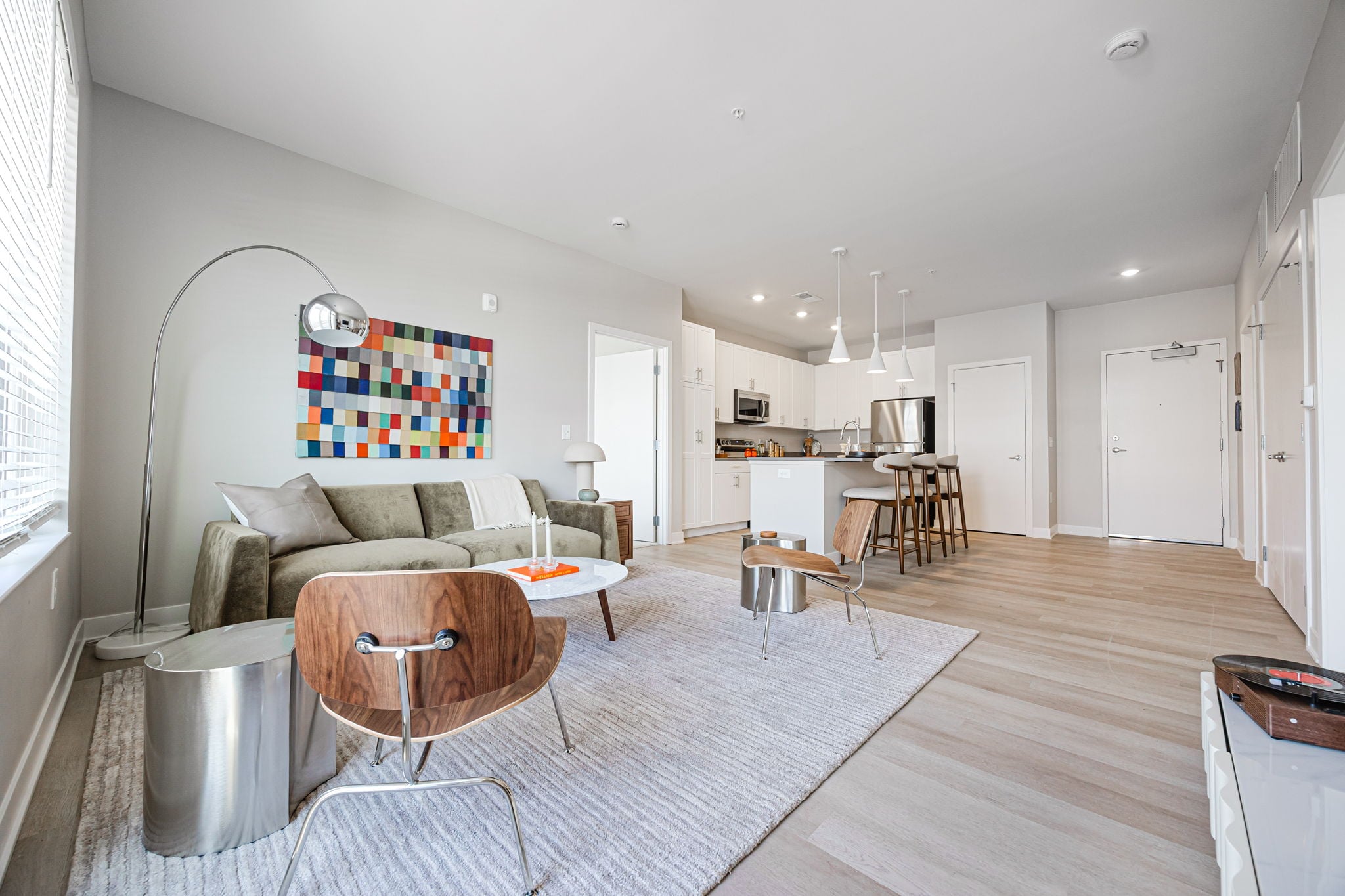 Open-concept apartment at Westrich featuring a modern kitchen, luxury finishes, and spacious living area near The James Cancer Hospital.
