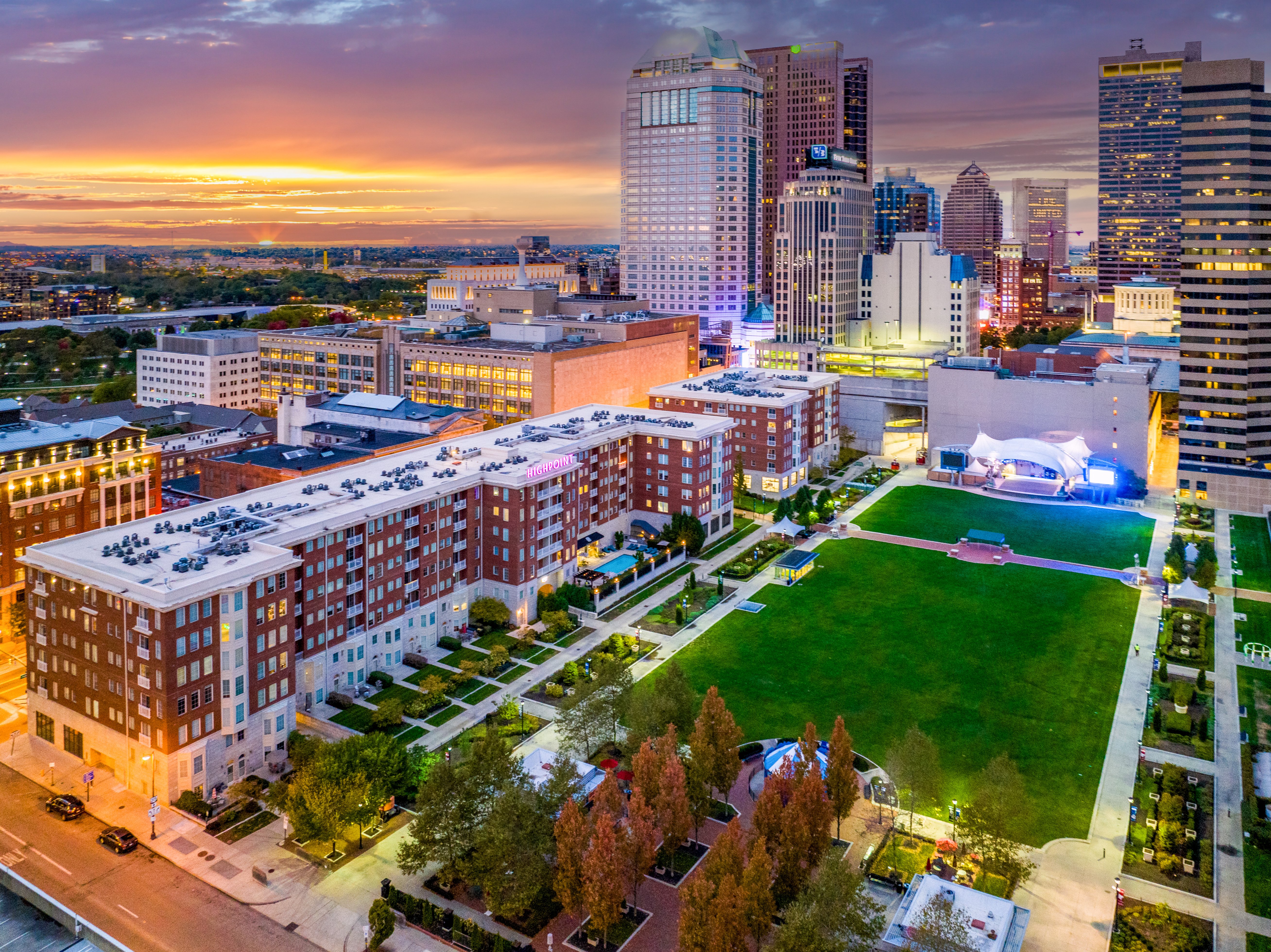 Aerial view of Highpoint on Columbus Commons with the Downtown Columbus skyline, offering luxury apartments near The James Cancer Hospital.