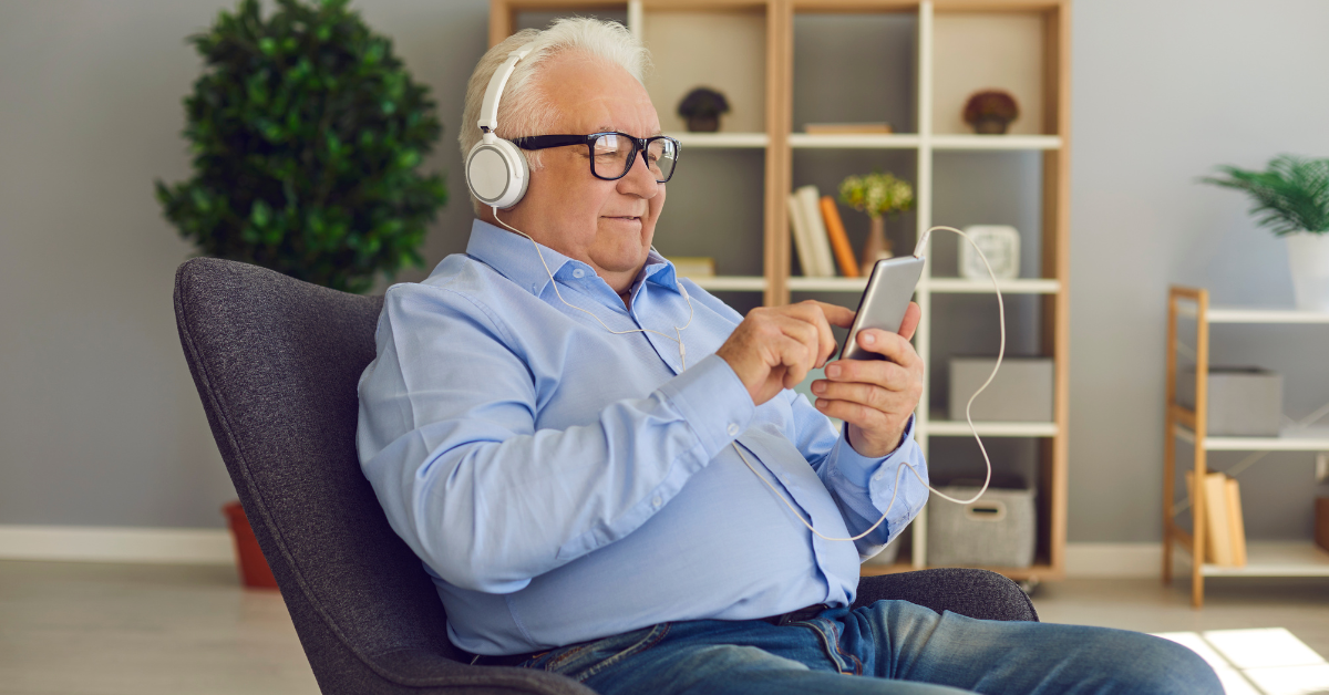 senior listening to podcasts in independent living