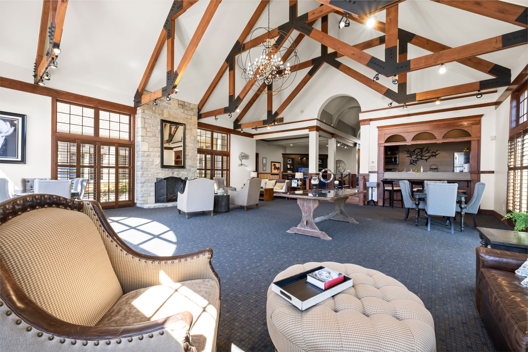 Resident clubhouse lounge with exposed wood beams at Asherton of Dublin apartments in Dublin, Ohio.