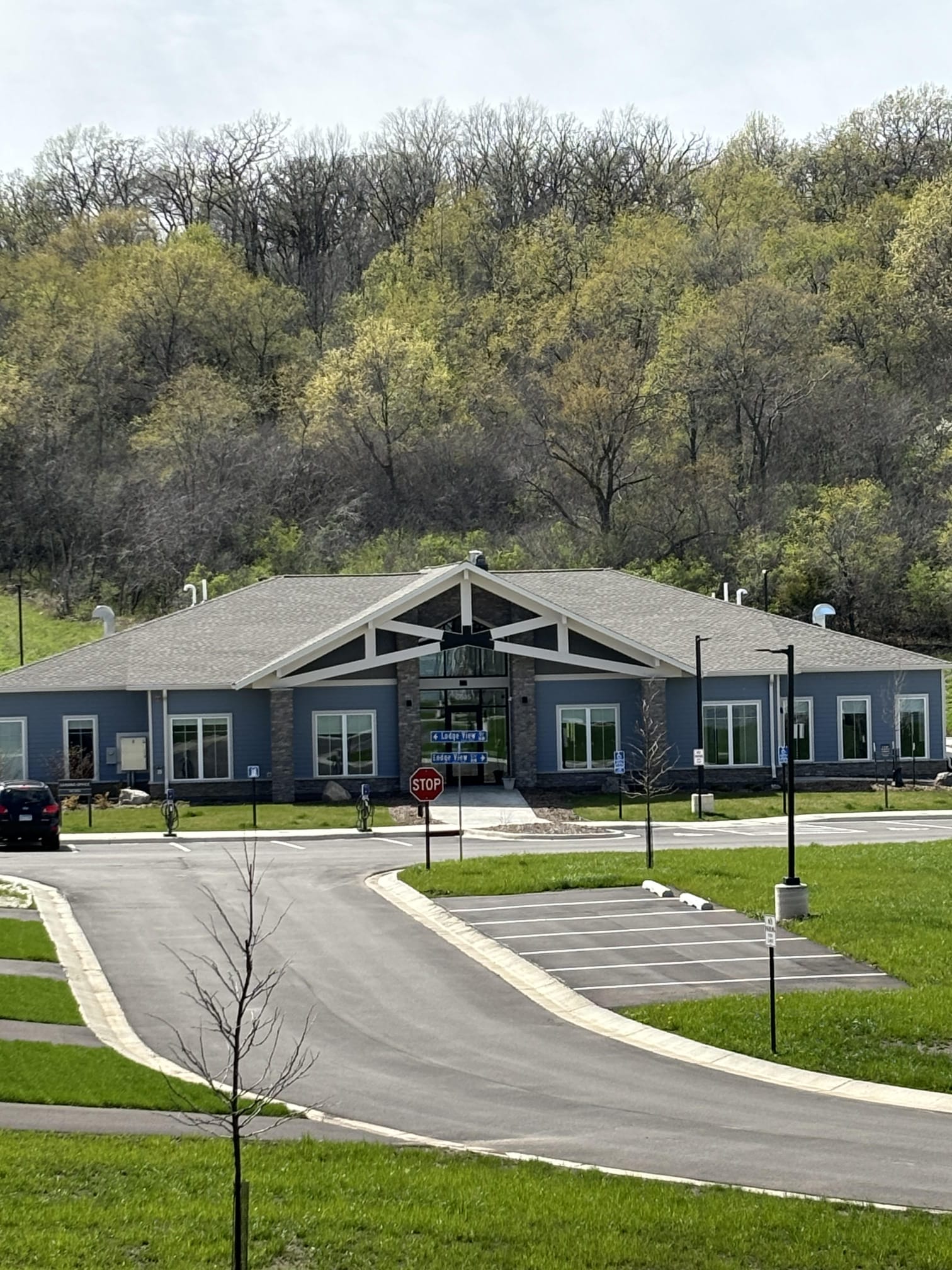 The Lodge at Overland apartments in fall - exterior of the clubhouse - Rochester MN weather in autumn