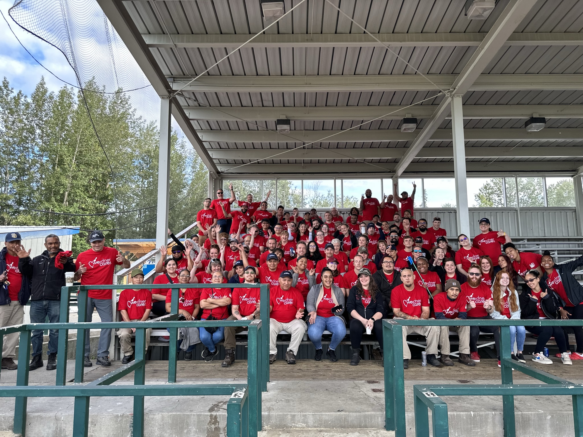 The Weidner Apartment Homes team at the Mulcahy Stadium in Anchorage AK, for their annual Weidner Cares philanthropy day.