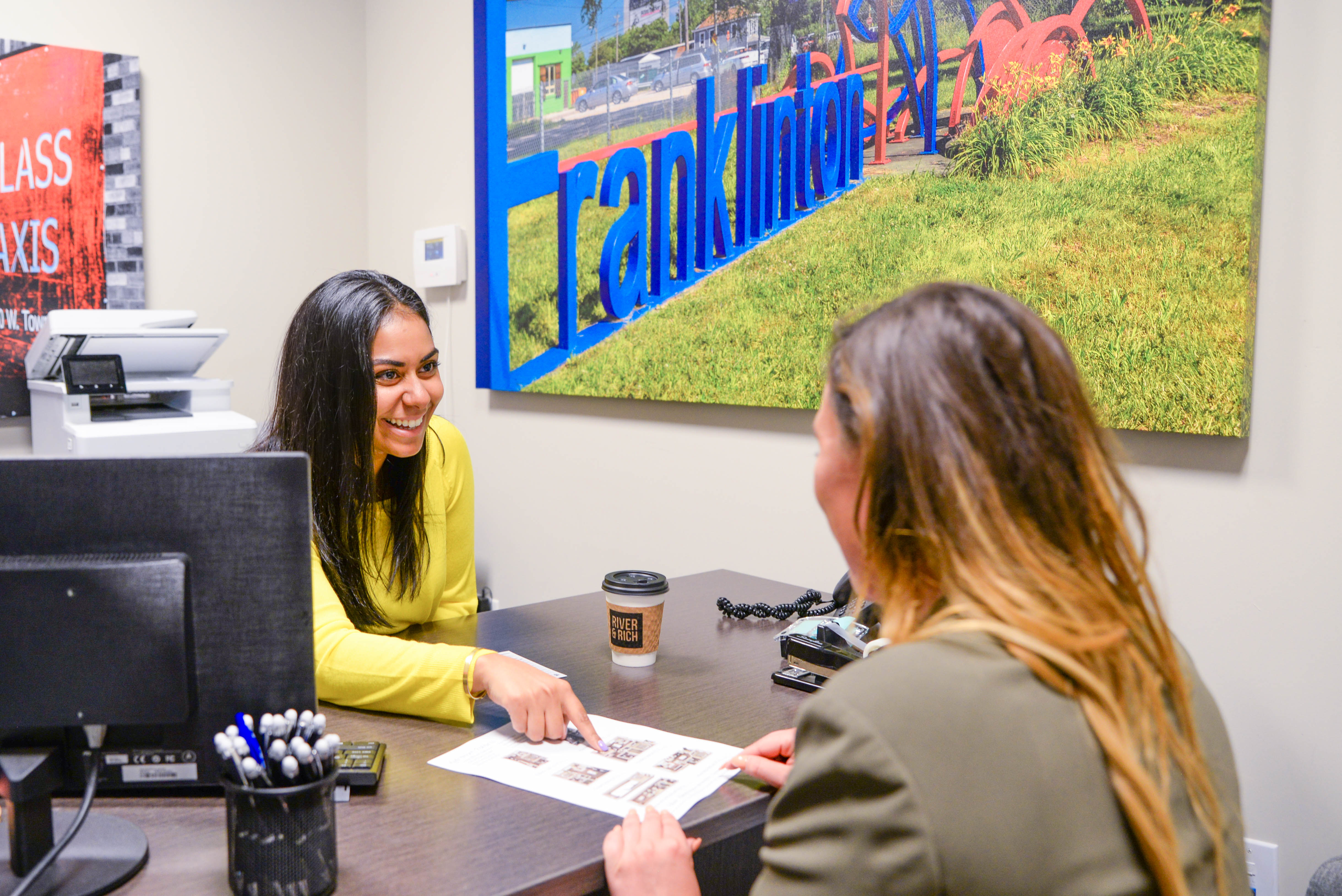 Oakwood leasing specialist helping a prospective resident find the right apartment community in Columbus, Ohio.