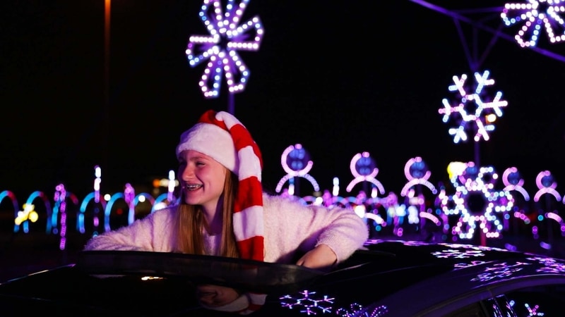 Young girl enjoying holiday light show