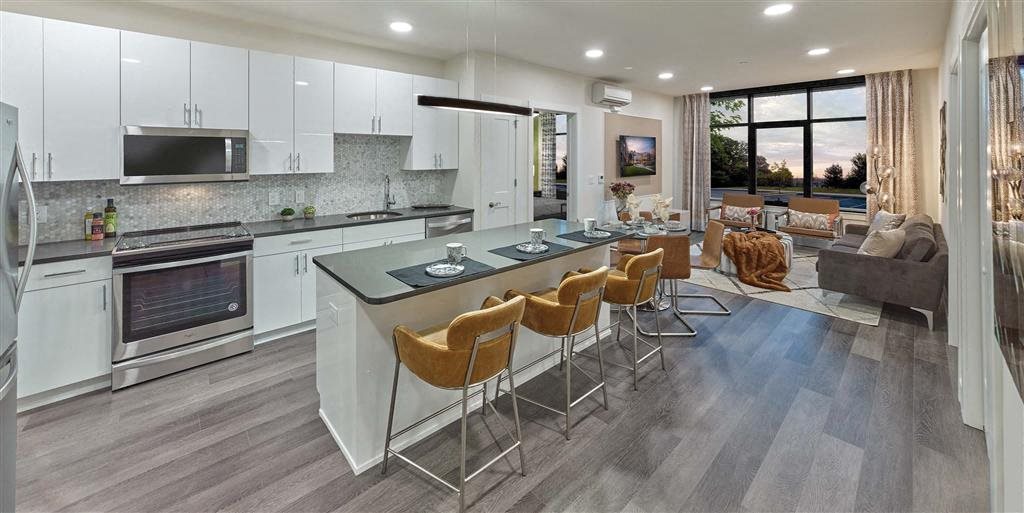 Modern kitchen with large island and oversized windows at Vermella Union, Union NJ