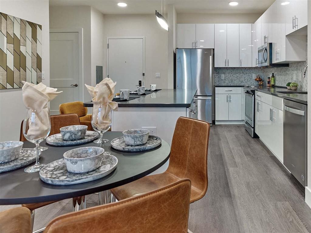 Dining table in open kitchen and dining area at Vermella Union, Union NJ