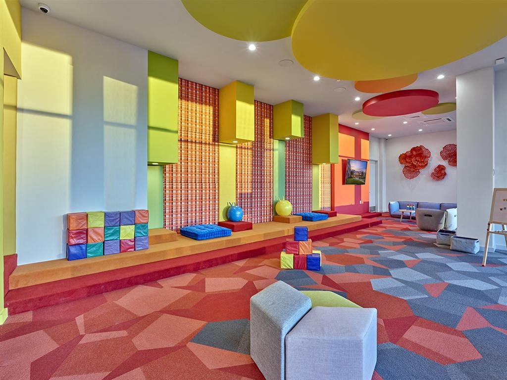 Playroom with vibrant design and kid-friendly activities at Vermella Union, Union NJ