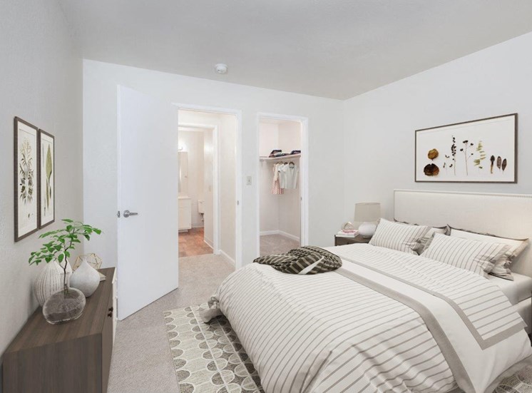Apartments Pleasant Hill CA - Spacious Bedroom with Carpeted Floors, Stylish Decor, and Walk-In Closet