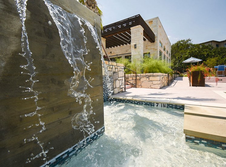 Close up of community pool and waterfall at Terra, Austin