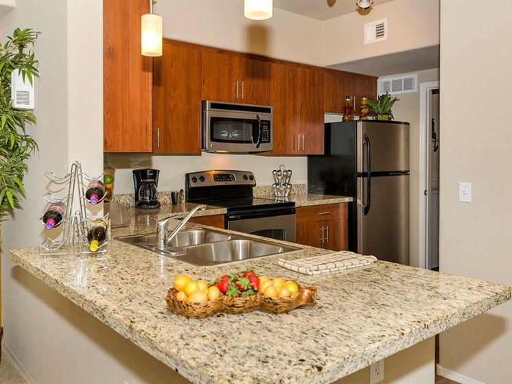Model apartment home kitchen emphasizing countertops