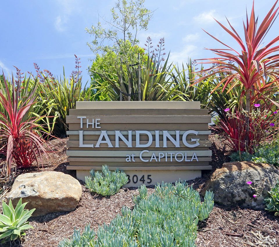 landmark sign with logo and landscaping