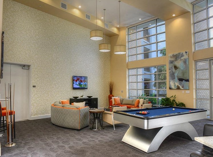 Resident lounge with wall tv, billiard and seating area
