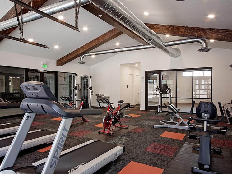 24 hour fitness center with cardio equipment and weights