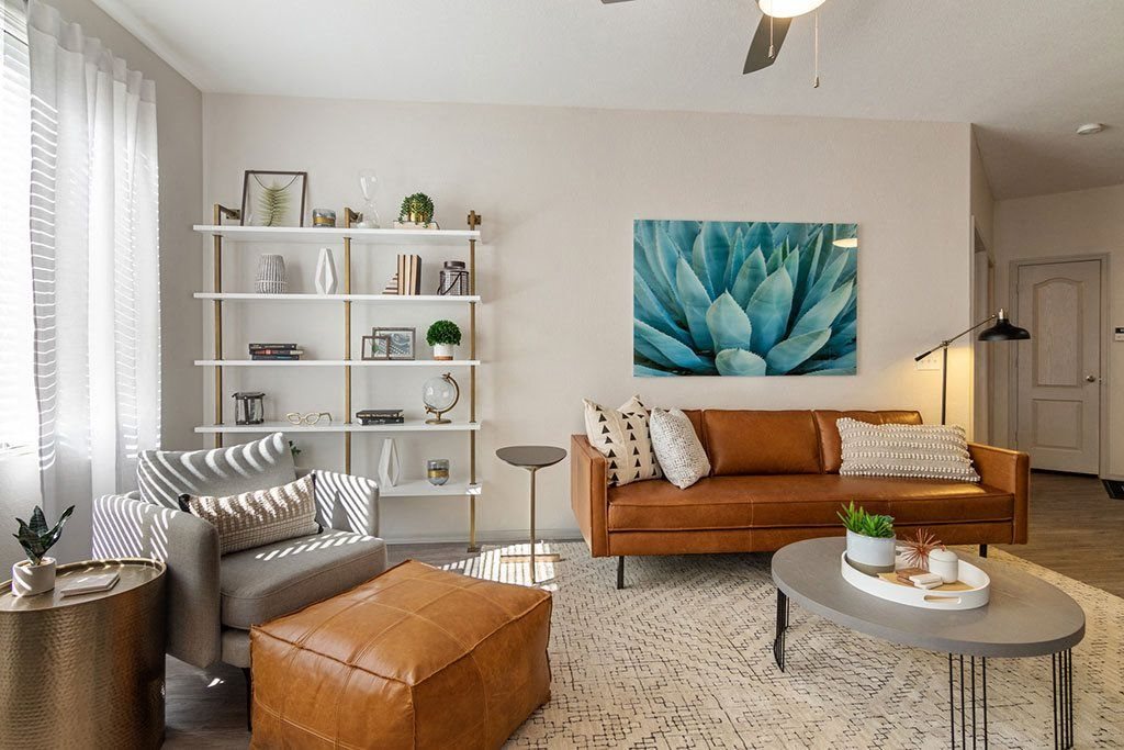 a living room filled with furniture and a painting of a succulent at Element Deer Valley, Phoenix, Arizona