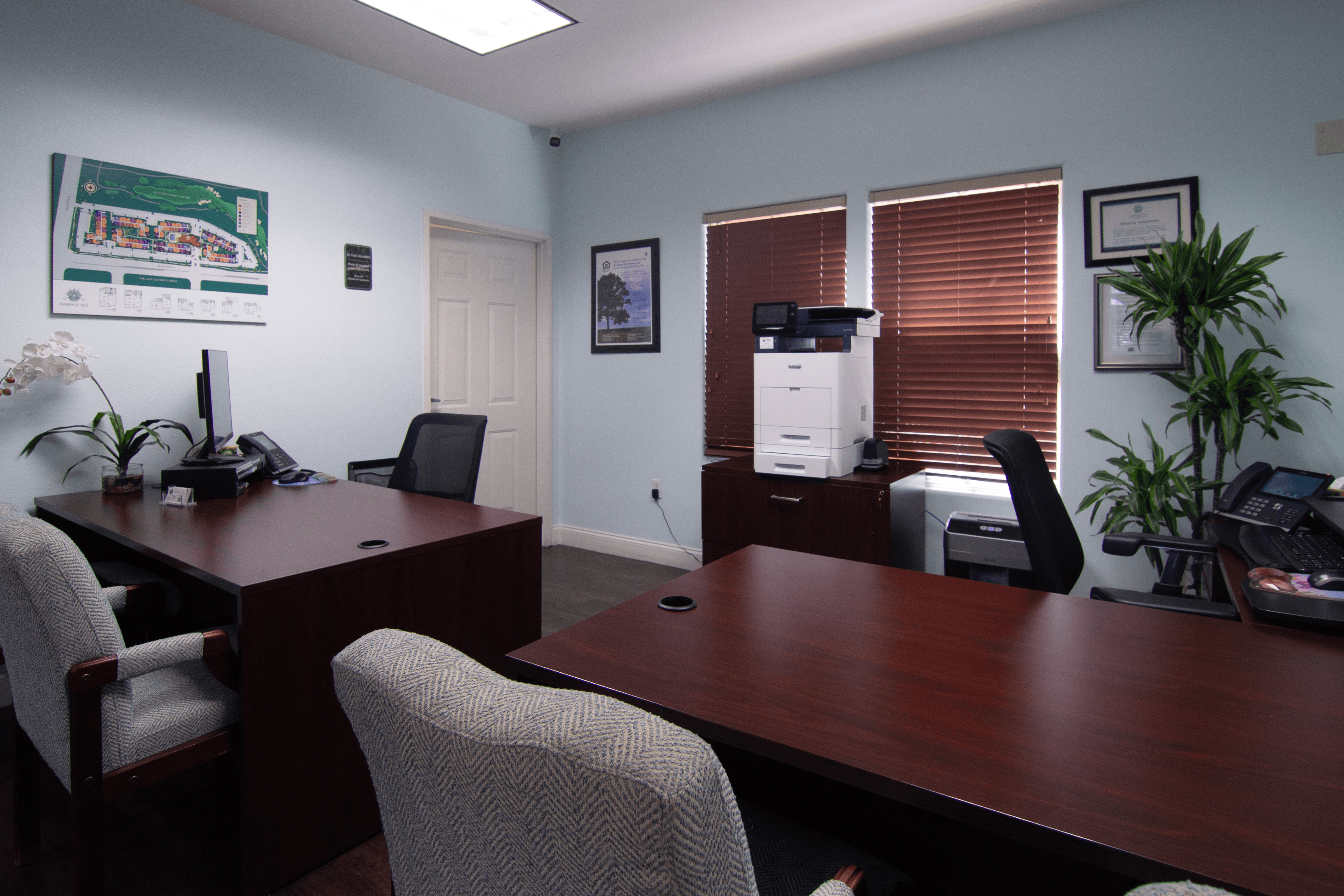 A room with a desk and chairs.,A room with a desk and chairs.