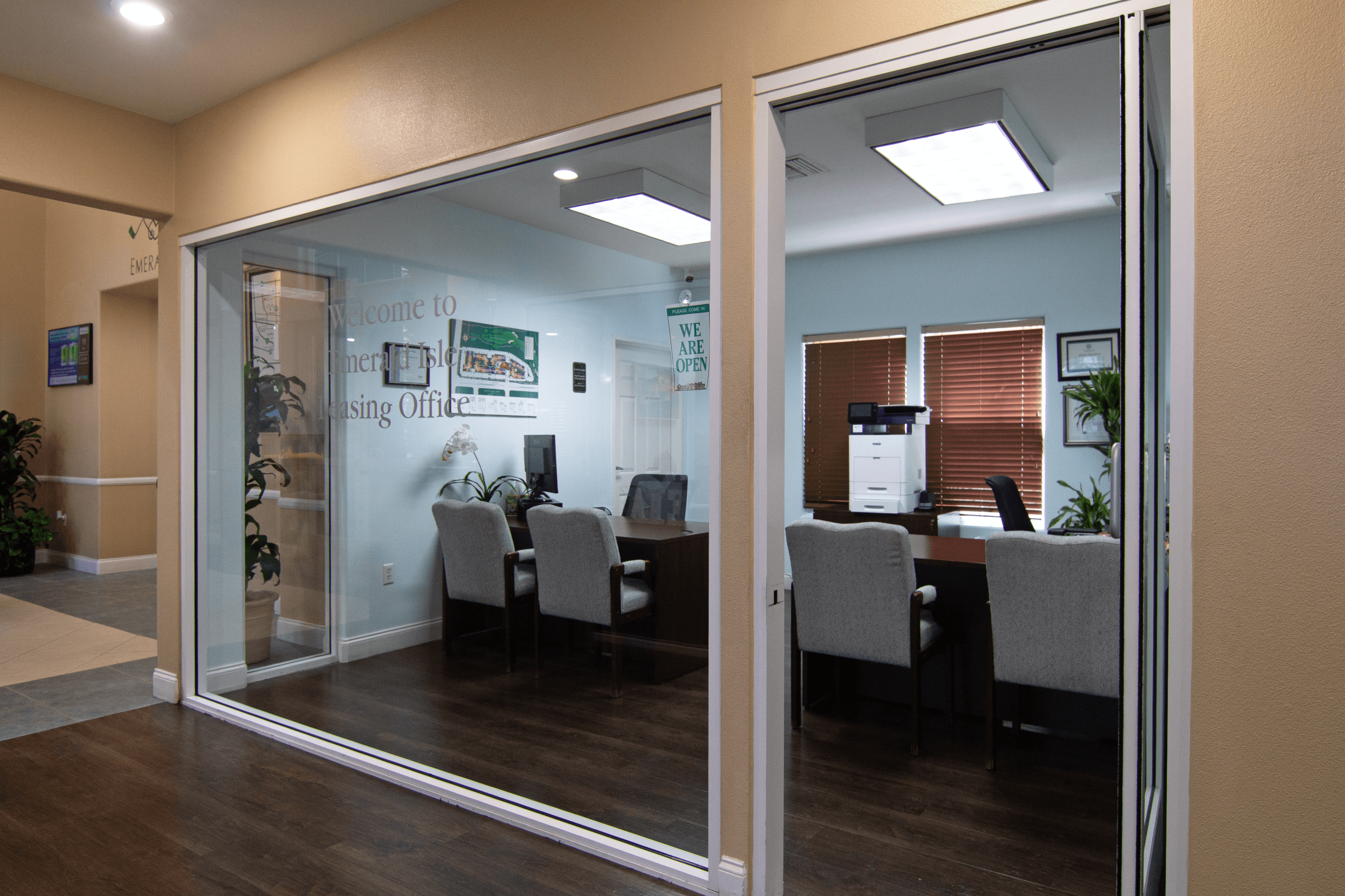 A glass door with a sign that says "Welcome to the Hiring Office" on it.,A glass door with a sign that says "Welcome to the Hiring Office" on it.