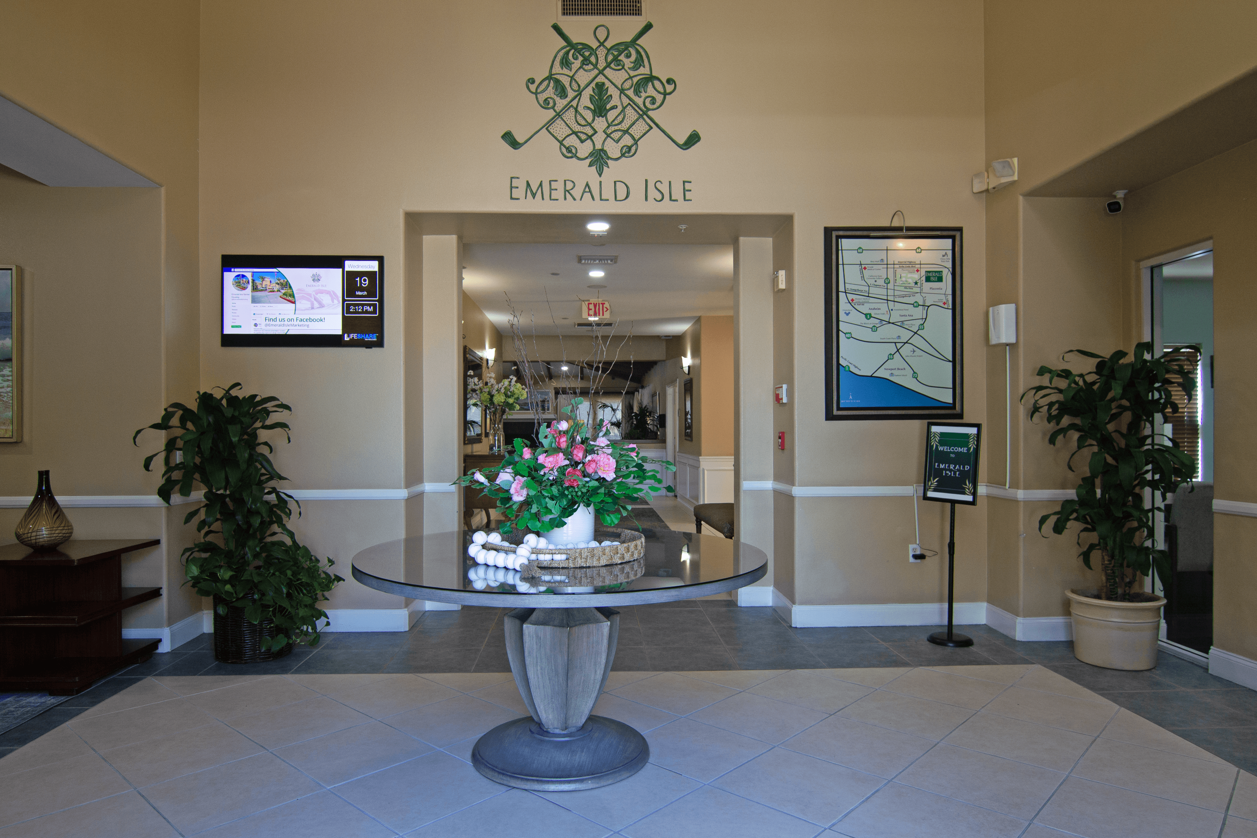 The lobby of Emerald Isle with a large table in the middle.,The lobby of Emerald Isle with a large table in the middle.