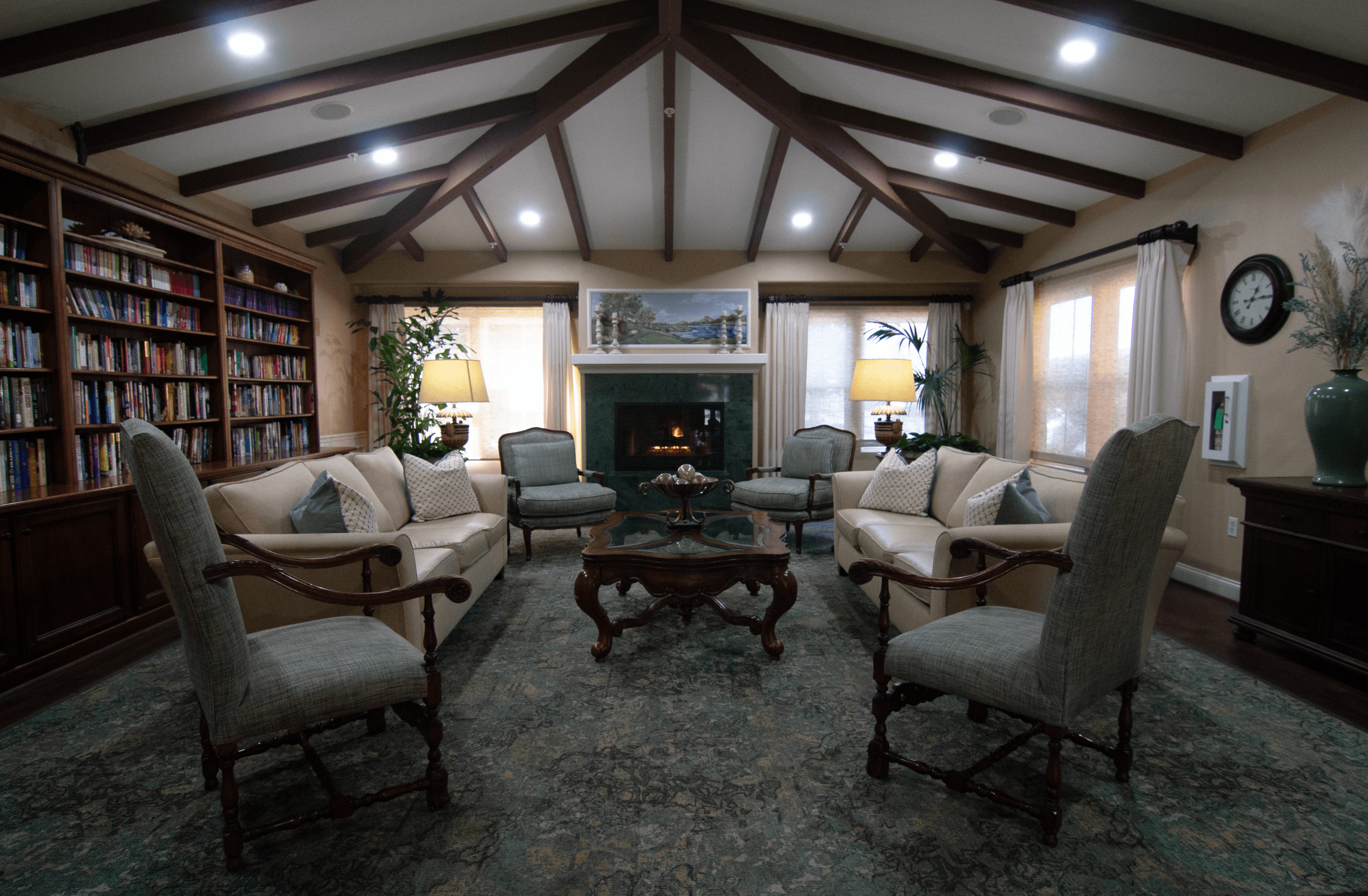A cozy living room with a fireplace and comfortable seating.,A cozy living room with a fireplace and comfortable seating.