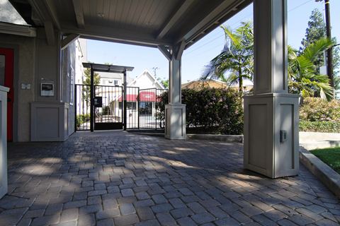 A gate with a metal railing is closed.