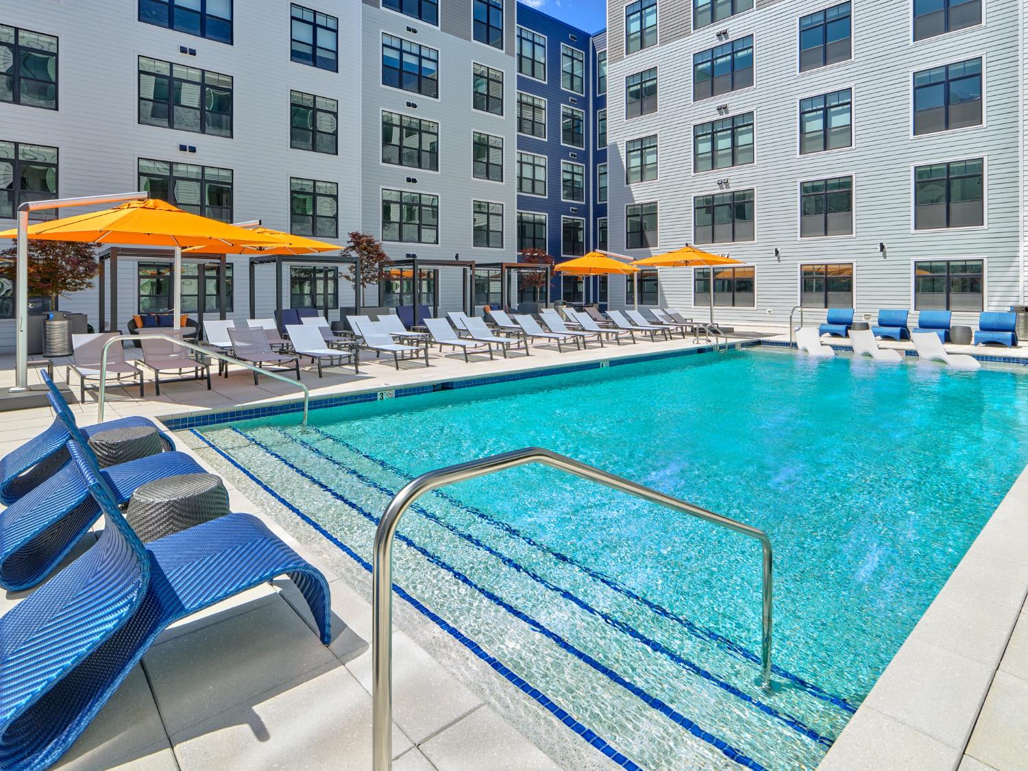 The Willard pool with lounge seating and summer amenity space