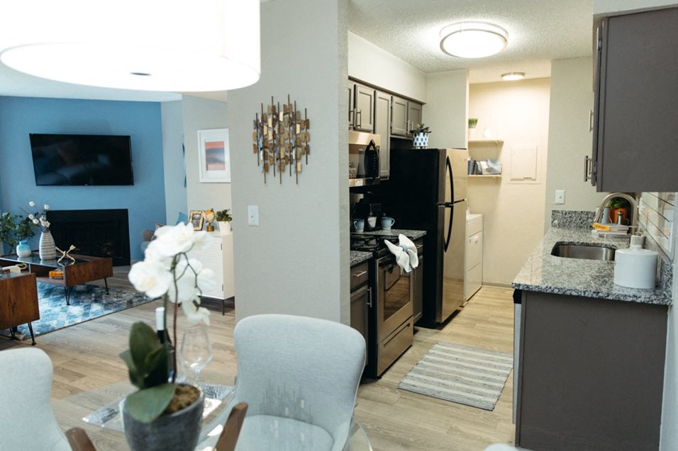 a view of the kitchen and living room from the dining room