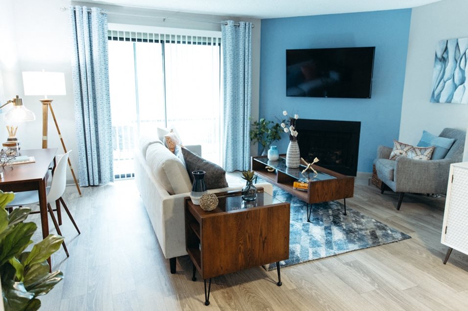 a living room with a couch and a table and a television