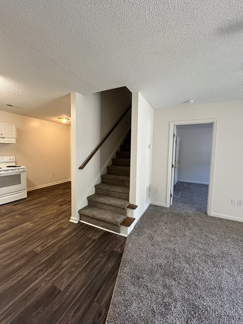 A room with a staircase leading to the second floor.