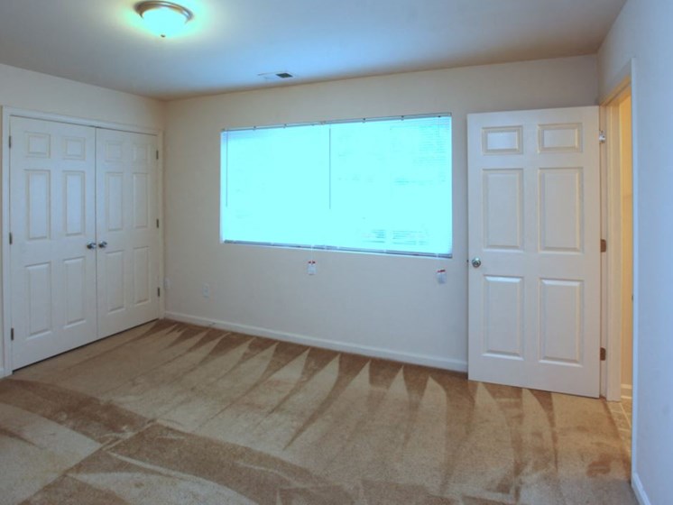 Master Bedroom with window and 2 closets